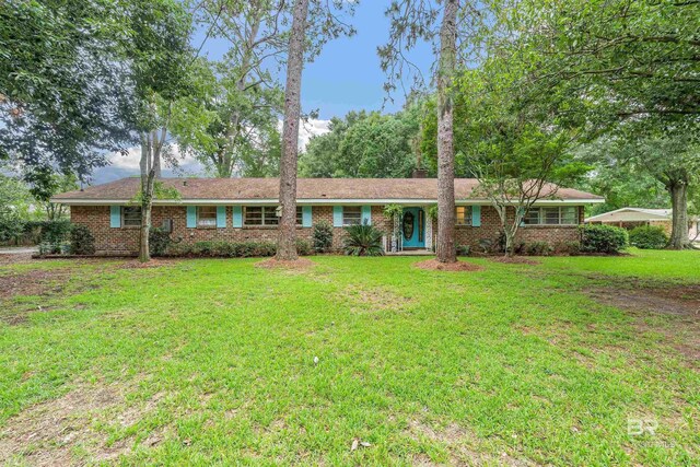 ranch-style house featuring a front lawn