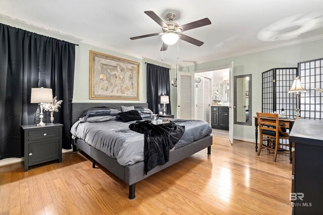 bedroom with ceiling fan, ensuite bathroom, light hardwood / wood-style flooring, and ornamental molding