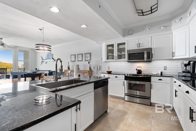 kitchen featuring white cabinets, sink, and appliances with stainless steel finishes