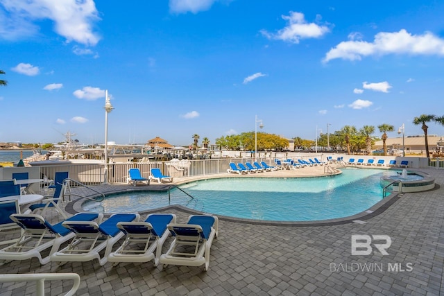 view of swimming pool with a patio