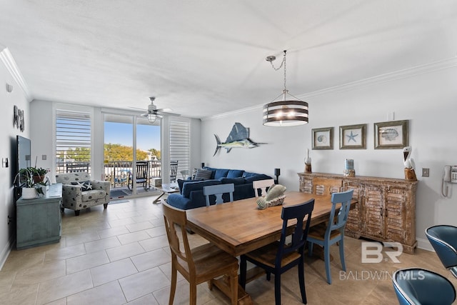 tiled dining area with ceiling fan with notable chandelier and ornamental molding