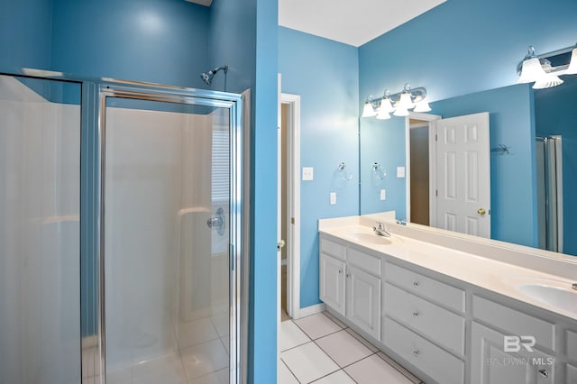 bathroom with a sink, tile patterned flooring, and a stall shower