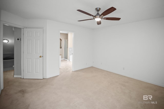 unfurnished room with baseboards, ceiling fan, and light carpet