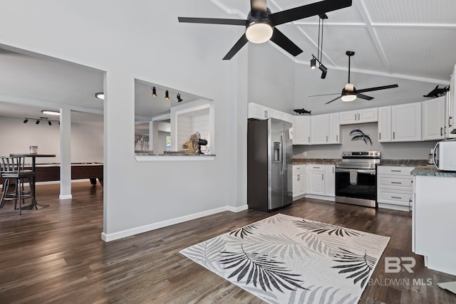 kitchen with ceiling fan, appliances with stainless steel finishes, high vaulted ceiling, dark hardwood / wood-style floors, and white cabinets