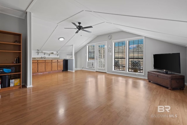 bonus room with lofted ceiling, cooling unit, ceiling fan, and light wood-type flooring