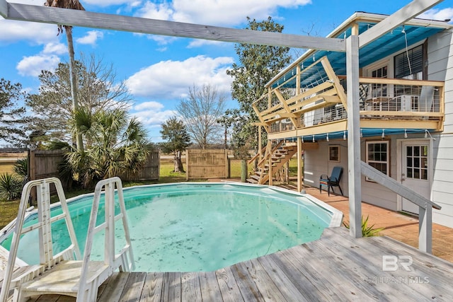 view of pool with a wooden deck