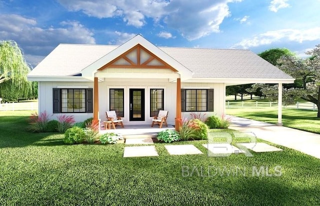 rear view of property with a porch and a lawn