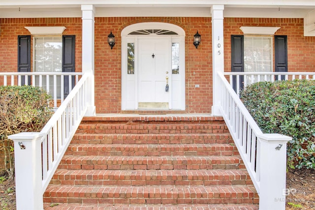 doorway to property featuring a porch