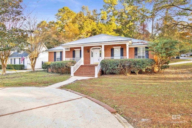 view of front of property with a porch and a front lawn