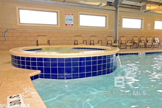 view of pool featuring pool water feature