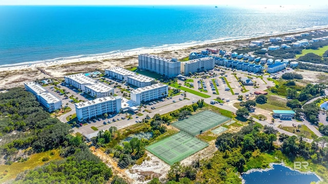 birds eye view of property featuring a view of the beach and a water view