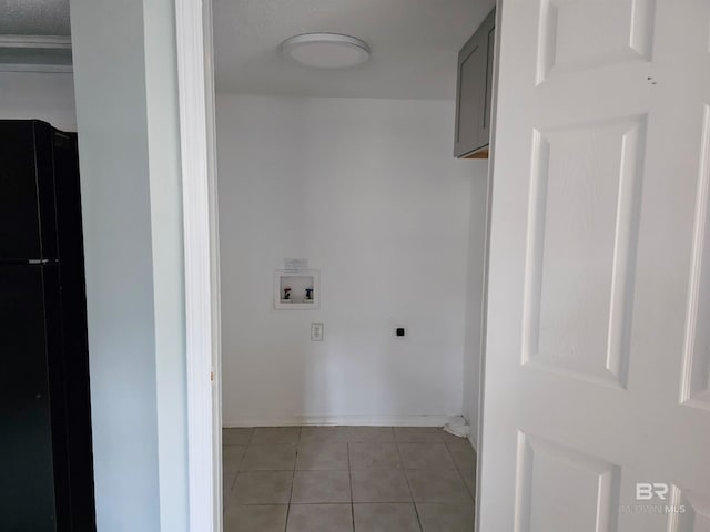 washroom featuring washer hookup, light tile patterned floors, and electric dryer hookup