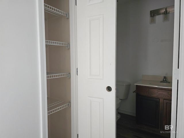 bathroom featuring vanity and toilet