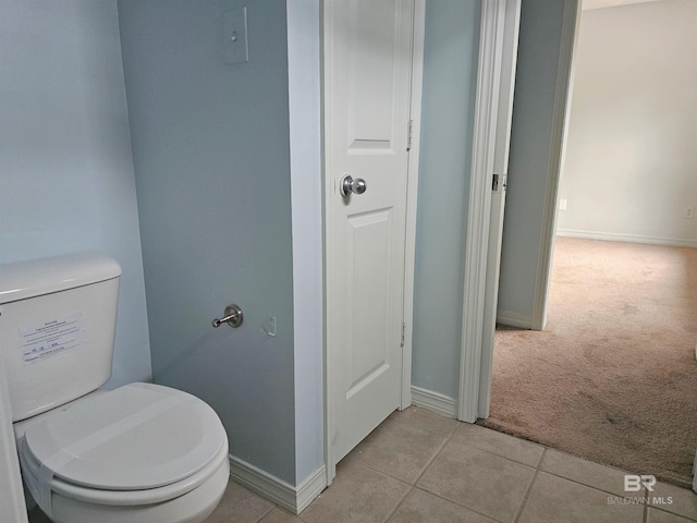 bathroom featuring tile patterned floors and toilet