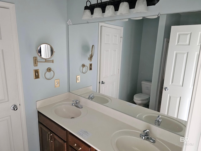 bathroom with vanity and toilet