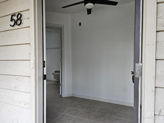 doorway to property with a wall mounted AC and ceiling fan