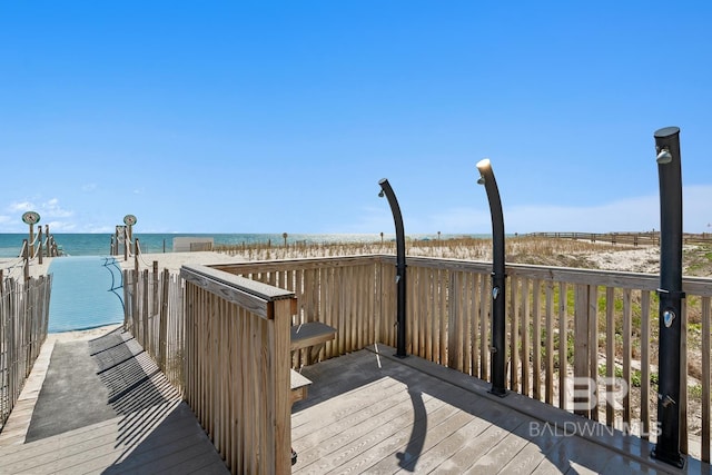 wooden terrace with a water view