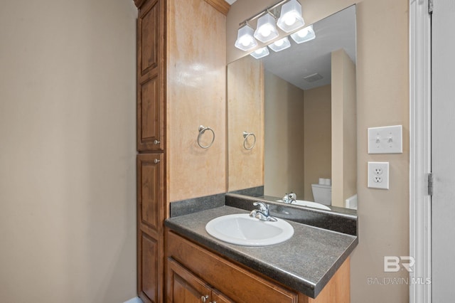 half bath with vanity and toilet