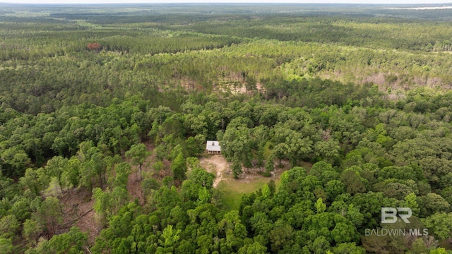 aerial view of property's location with a heavily wooded area