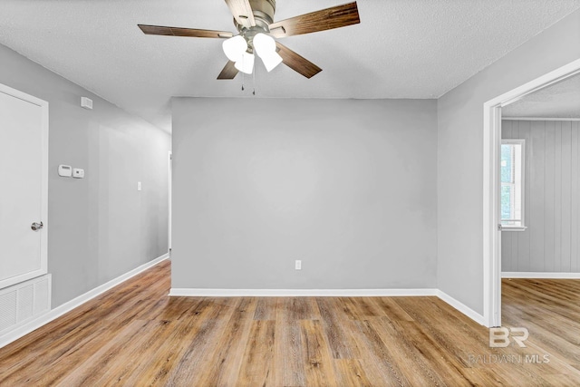 3304 Armond St, Mobile, AL 36605 - unfurnished room featuring a ceiling fan, wood finished floors, and a textured ceiling