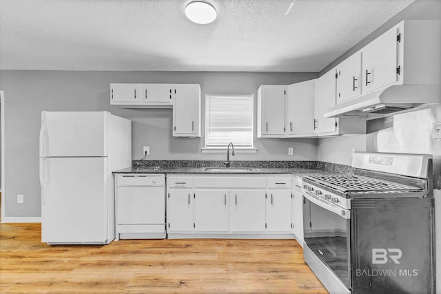 3304 Armond St, Mobile, AL 36605 - kitchen featuring white appliances, a textured ceiling, under cabinet range hood, white cabinets, and light wood-type flooring