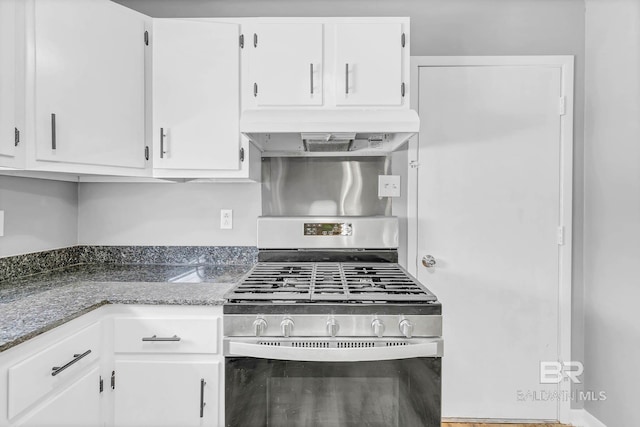 3304 Armond St, Mobile, AL 36605 - kitchen featuring gas stove, custom range hood, white cabinetry, and dark stone countertops