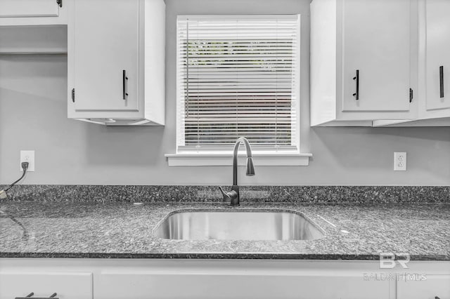 3304 Armond St, Mobile, AL 36605 - kitchen featuring white cabinets and dark stone counters