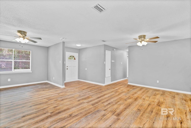 3304 Armond St, Mobile, AL 36605 - unfurnished room with a ceiling fan, wood finished floors, and a textured ceiling