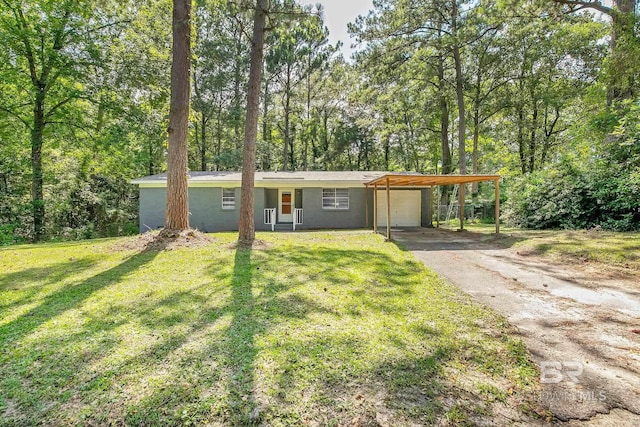 3304 Armond St, Mobile, AL 36605 - view of front of property with asphalt driveway, a carport, and a front lawn