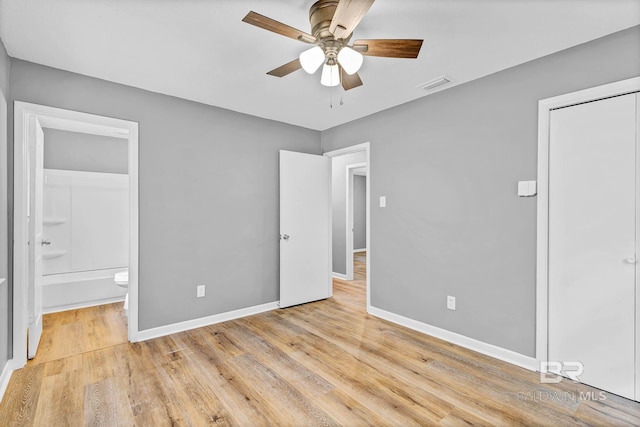 3304 Armond St, Mobile, AL 36605 - unfurnished bedroom with light wood-style flooring, connected bathroom, and ceiling fan