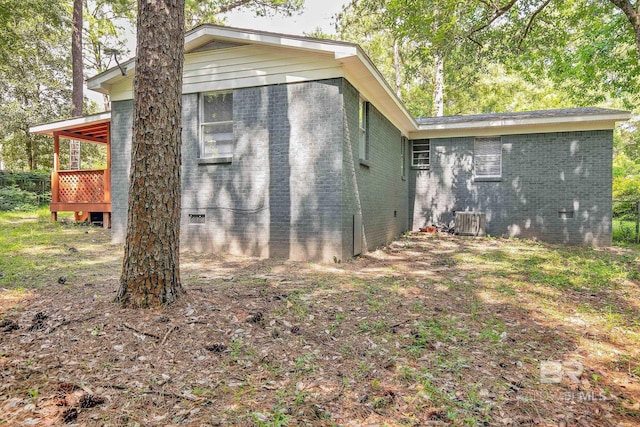 3304 Armond St, Mobile, AL 36605 - view of side of property with brick siding, a deck, and crawl space