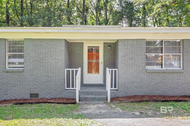 3304 Armond St, Mobile, AL 36605 - view of exterior entry with crawl space and brick siding