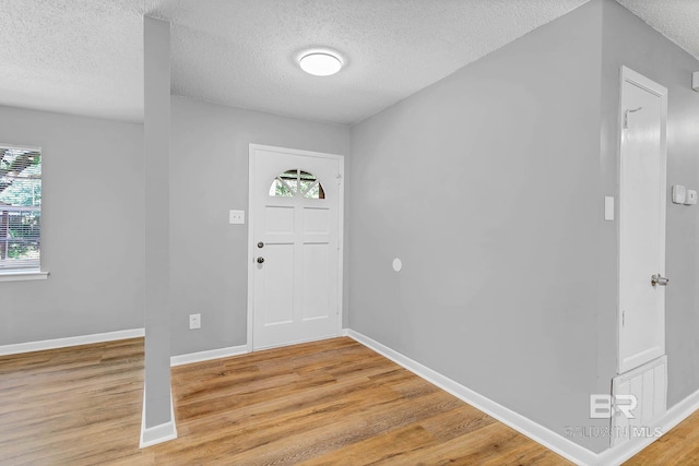 3304 Armond St, Mobile, AL 36605 - foyer featuring a textured ceiling and light wood-type flooring