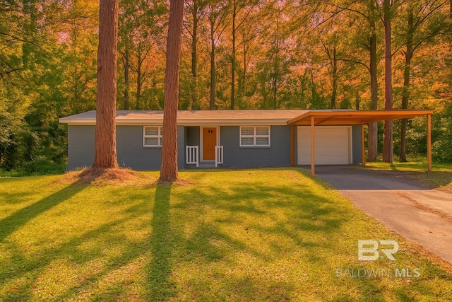 3304 Armond St, Mobile, AL 36605 - view of front of property with a carport, a front lawn, driveway, and a garage