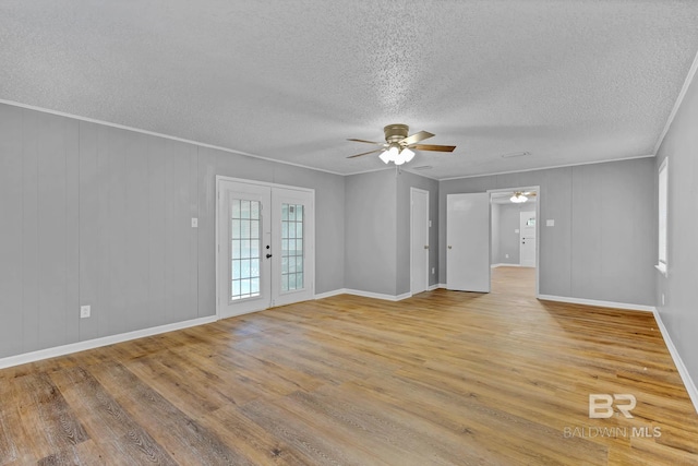 3304 Armond St, Mobile, AL 36605 - spare room with a textured ceiling, ceiling fan, wood finished floors, french doors, and crown molding