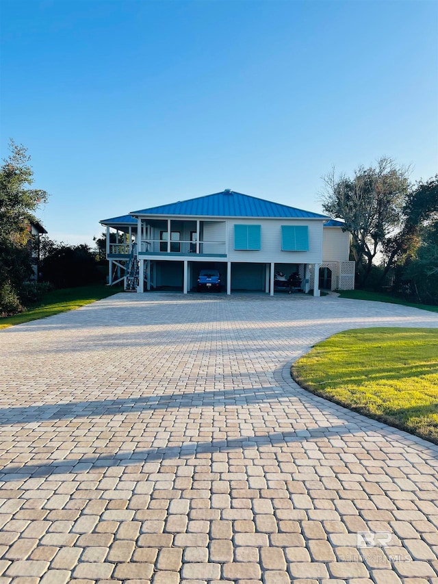 view of front of home with a carport