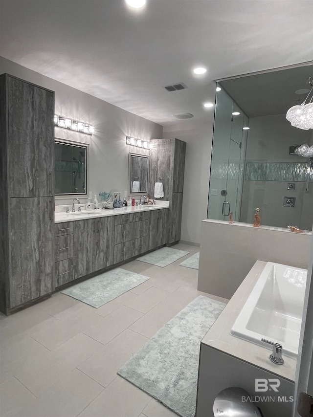 bathroom with vanity, walk in shower, and tile patterned flooring