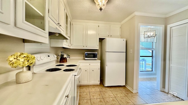 kitchen with crown molding, a textured ceiling, white appliances, light tile patterned floors, and white cabinets