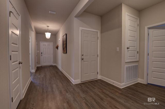 hallway featuring dark hardwood / wood-style floors