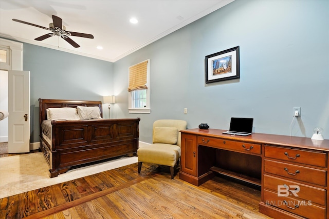 bedroom with crown molding, ceiling fan, and light hardwood / wood-style floors