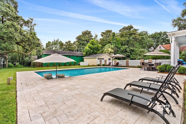 view of pool with an outdoor structure and a patio