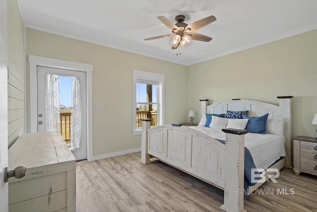 bedroom featuring light hardwood / wood-style floors, multiple windows, and ceiling fan