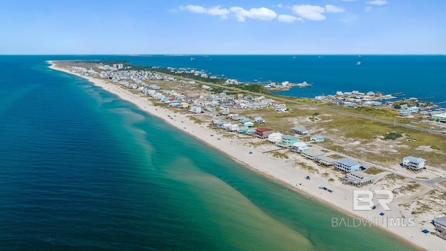 birds eye view of property with a view of the beach and a water view