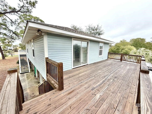 wooden deck featuring stairs