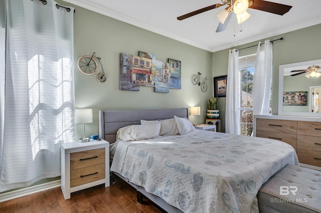 bedroom featuring ceiling fan, dark wood-style floors, and ornamental molding