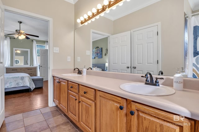 full bath featuring tile patterned flooring, ensuite bath, and a sink