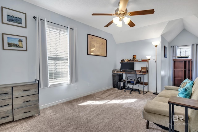 office area with baseboards, lofted ceiling, ceiling fan, and carpet flooring