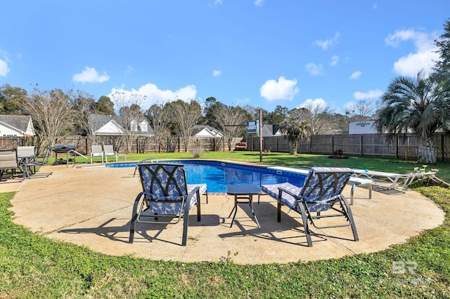 view of pool featuring a fenced backyard, a fenced in pool, a patio, and a yard