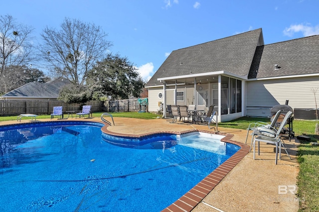 view of swimming pool with a fenced in pool, cooling unit, a fenced backyard, a sunroom, and a patio