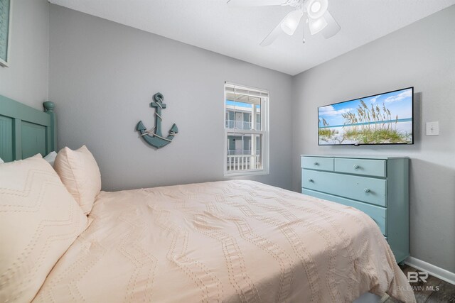 bedroom with wood-type flooring and ceiling fan